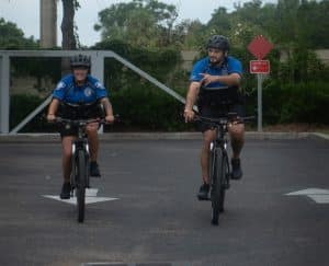 Male and female police officers on bicycles