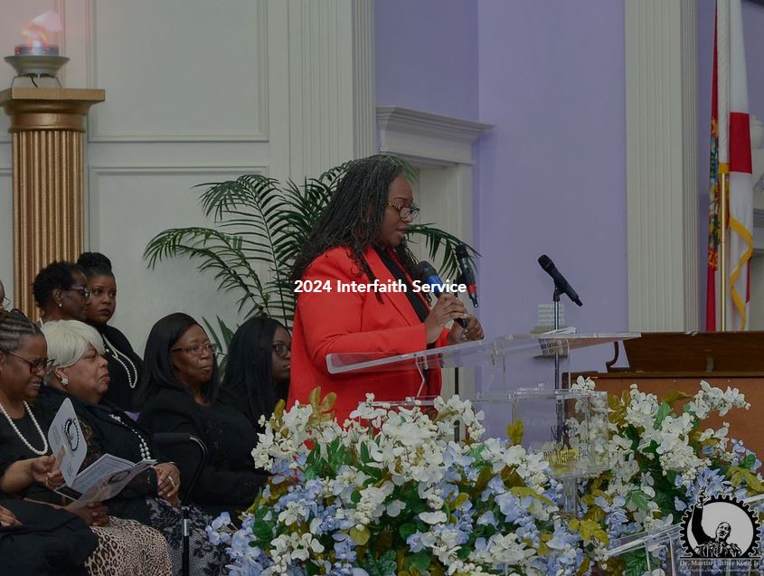 a prayer is said during the 2024 interfaith service in honor of Dr. Martin Luther King Jr
