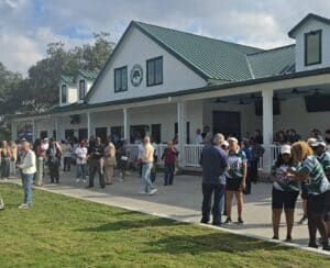 The community mingles outside the new Mayfair Country Club clubhouse