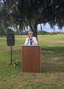 Commissioner Claudia Thomas speaks at an event